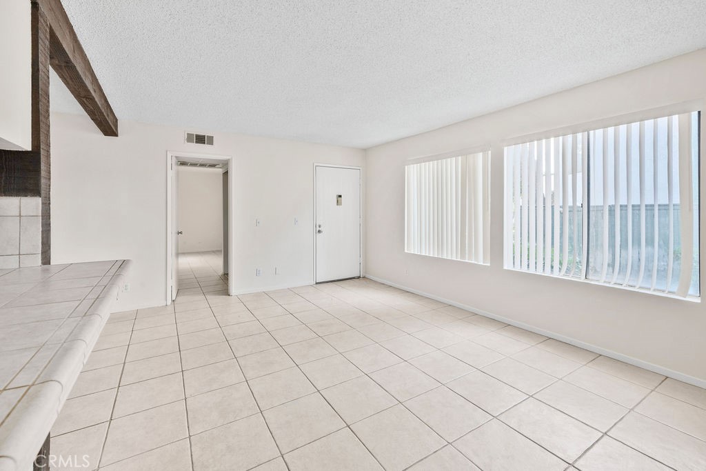 1735 East Washington Street, Unit F14 Colton, CA 92324 - Photo 8 of 26 a view of an empty room with a window