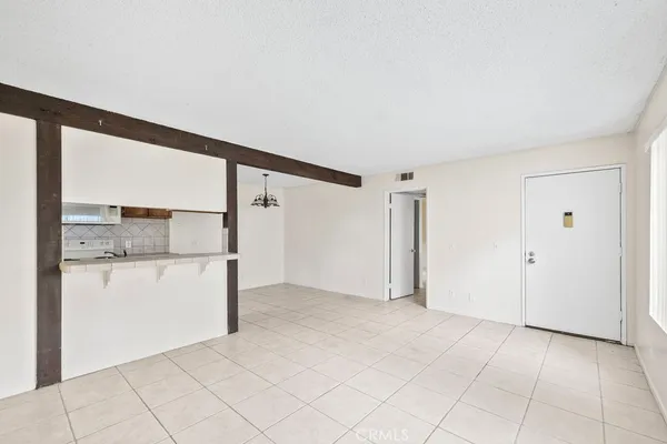 a large kitchen with cabinets and stainless steel appliances