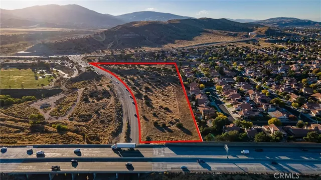 an aerial view of residential building and trees