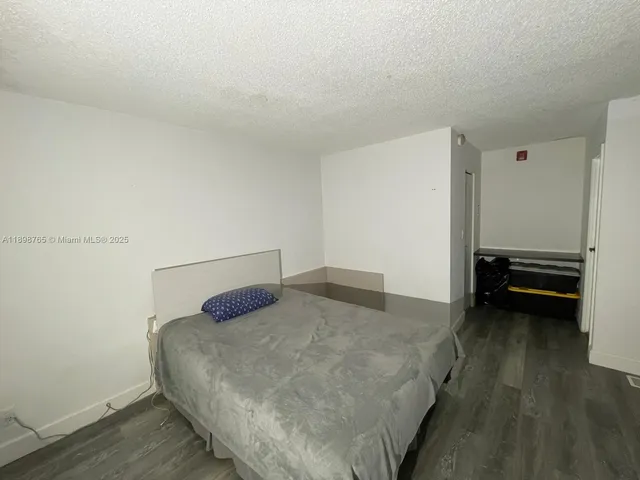 a bedroom with a bed and a cabinets