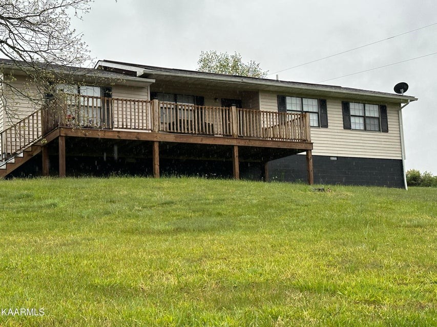 291 Dynatex Road Sunbright, TN 37872 - Photo 1 of 23 a view of a house with a backyard