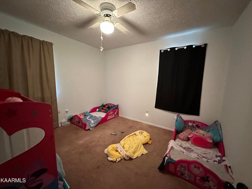 291 Dynatex Road Sunbright, TN 37872 - Photo 14 of 23 a bedroom with two bed and a painting on the wall