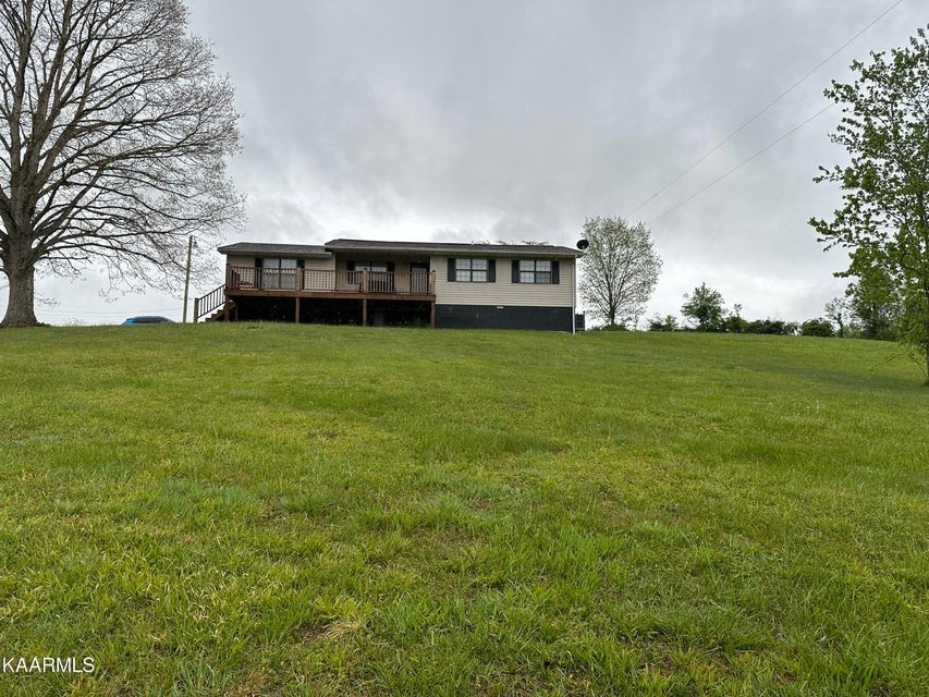 291 Dynatex Road Sunbright, TN 37872 - Photo 4 of 23 a view of a house with a big yard