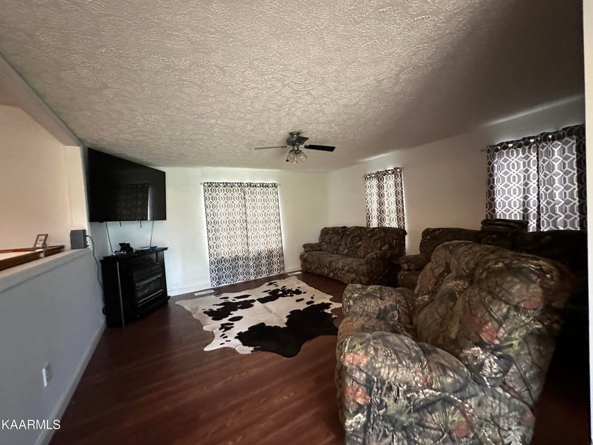 291 Dynatex Road Sunbright, TN 37872 - Photo 7 of 23 a living room with furniture and a flat screen tv