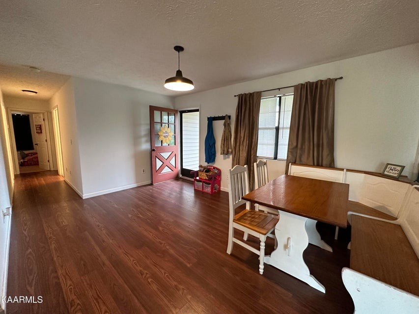 291 Dynatex Road Sunbright, TN 37872 - Photo 8 of 23 a living room with furniture a wooden floor and a window