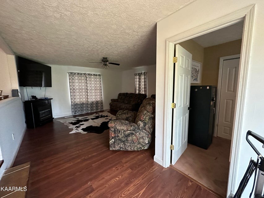 291 Dynatex Road Sunbright, TN 37872 - Photo 9 of 23 a view of a livingroom with furniture and a flat screen tv