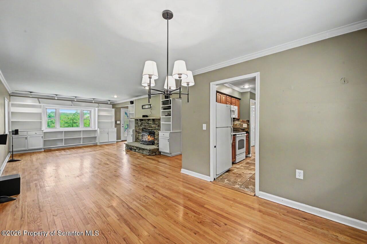 457 Craig Road Dalton, PA 18414 - Photo 26 of 114 a view of a livingroom with wooden floor fireplace and window