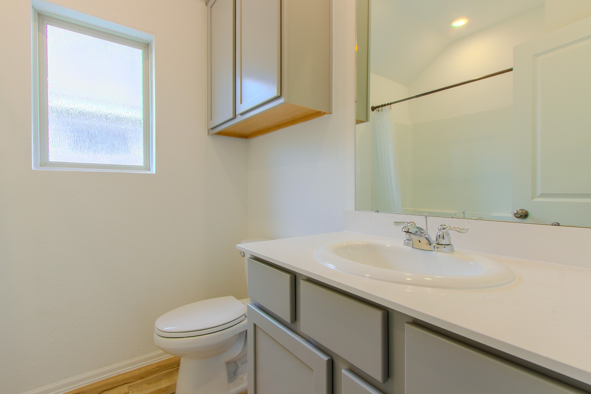 3113 Catalonion Court Conroe, TX 77301 - Photo 21 of 45 a bathroom with a sink and a toilet