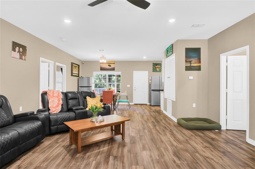 411 Johnson Street Longview, TX 75602 - Photo 11 of 25 a living room with furniture and wooden floor