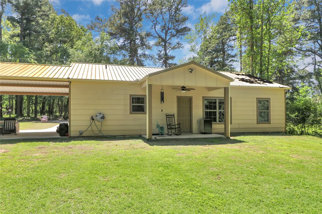 411 Johnson Street Longview, TX 75602 - Photo 6 of 25 a front view of a house with a yard