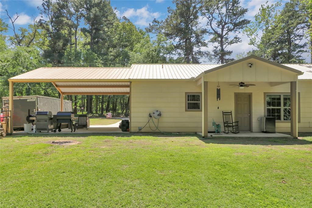 411 Johnson Street Longview, TX 75602 - Photo 7 of 25 a view of a house with sitting area and garden