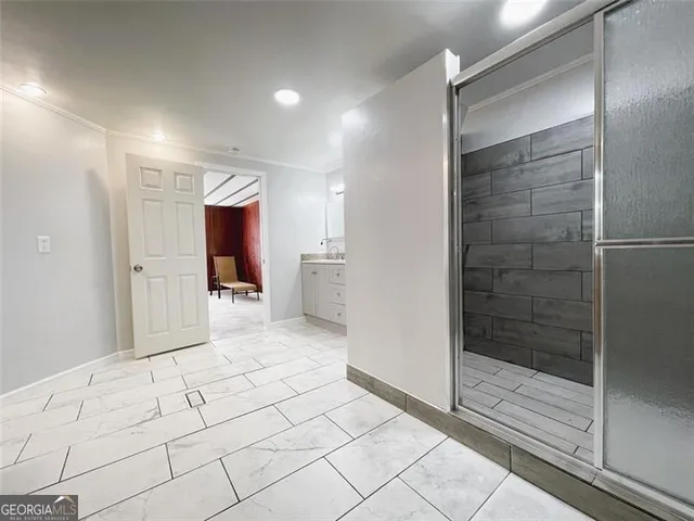 a view of an empty room with a window