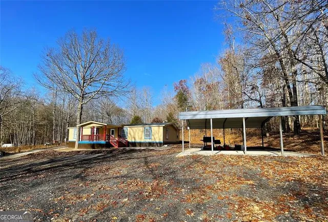 a view of road with card parked on side and road