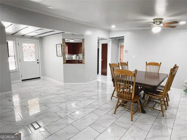 a view of a livingroom with furniture and a window