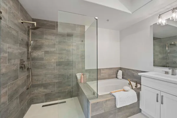 a view of a terrace with furniture and city view