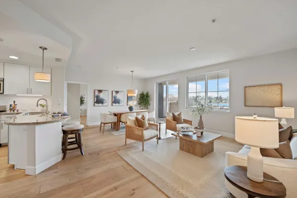 a living room with furniture and a table