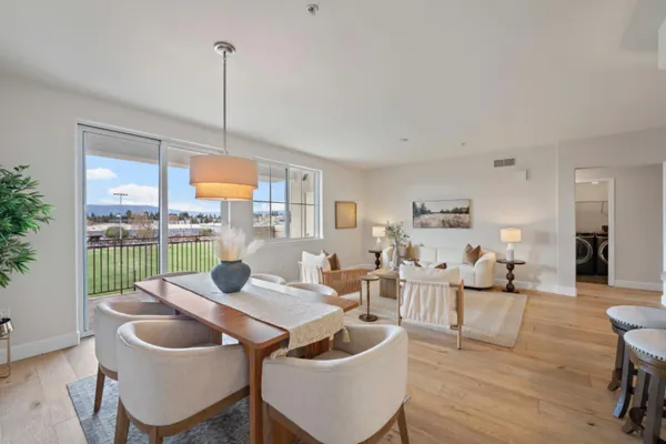 a living room with furniture and a lamp