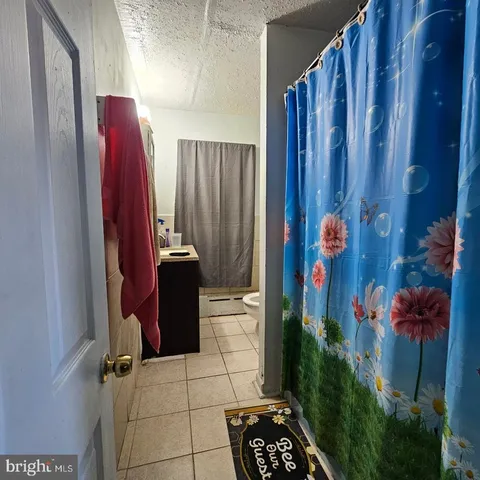 a view of storage and utility room with a door
