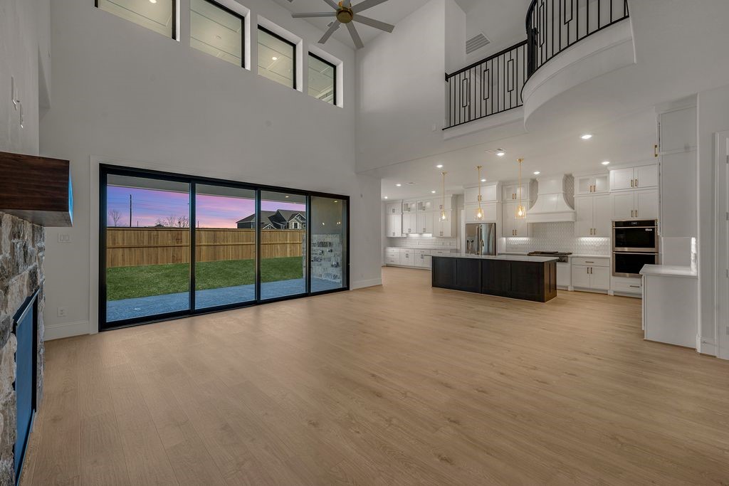a view of a kitchen with a floor to ceiling window and a kitchen view