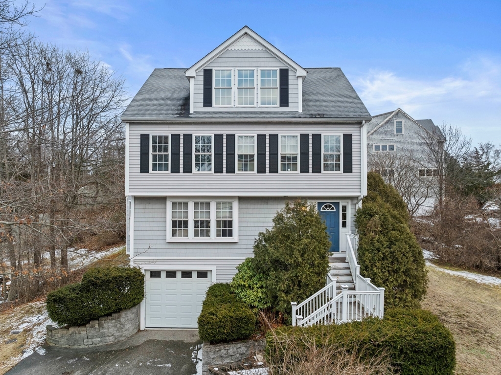 15 Alsada Road Hull, MA 02045 - Photo 1 of 41 a front view of a house with a yard and garage