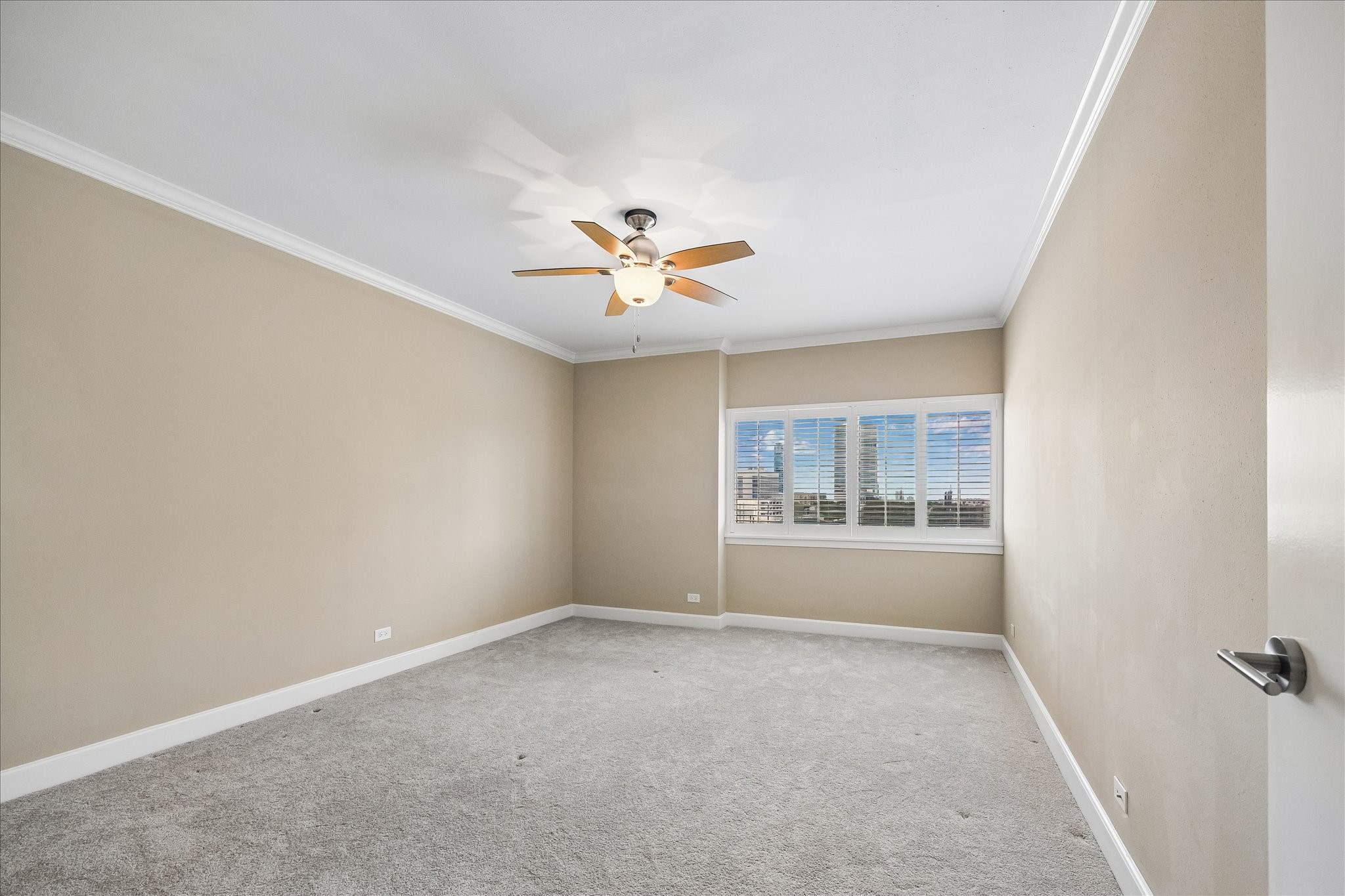 2929 Buffalo Speedway, Unit A513 Houston, TX 77098 - Photo 12 of 24 a view of a livingroom with a ceiling fan and window