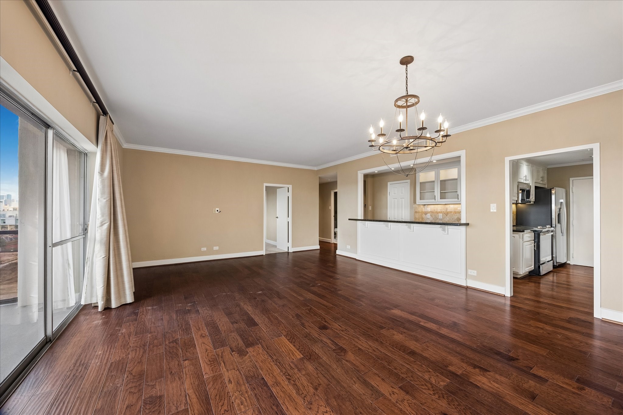 2929 Buffalo Speedway, Unit A513 Houston, TX 77098 - Photo 3 of 24 wooden floor in an empty room with a window