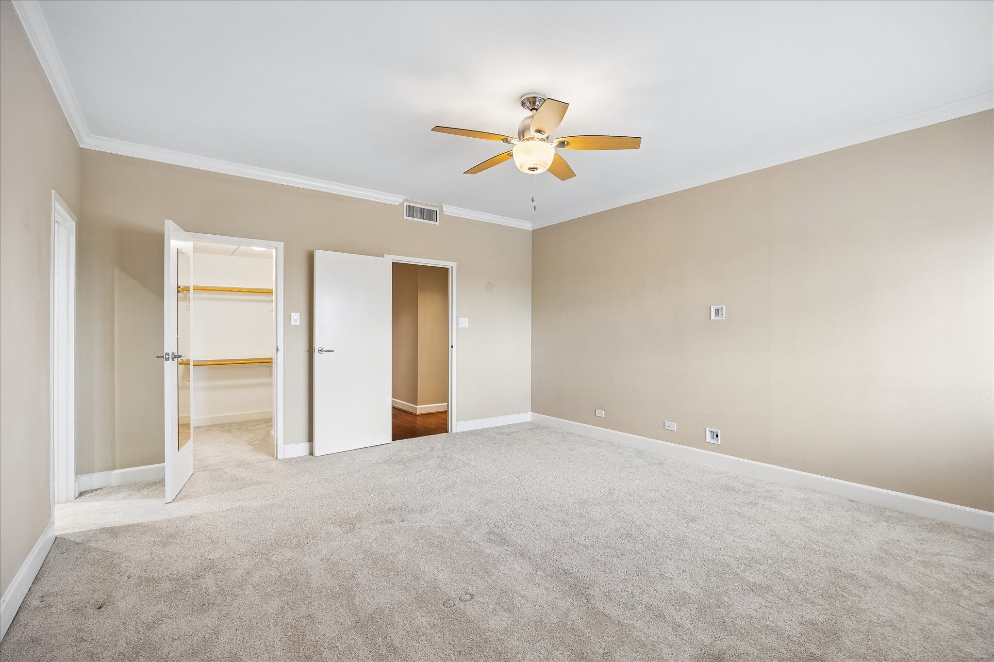 2929 Buffalo Speedway, Unit A513 Houston, TX 77098 - Photo 9 of 24 a view of an empty room and chandelier fan
