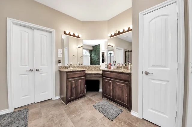 a large bathroom with a sink and a mirror
