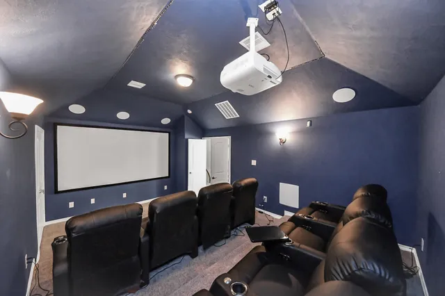 a projector room with furniture projector and screen
