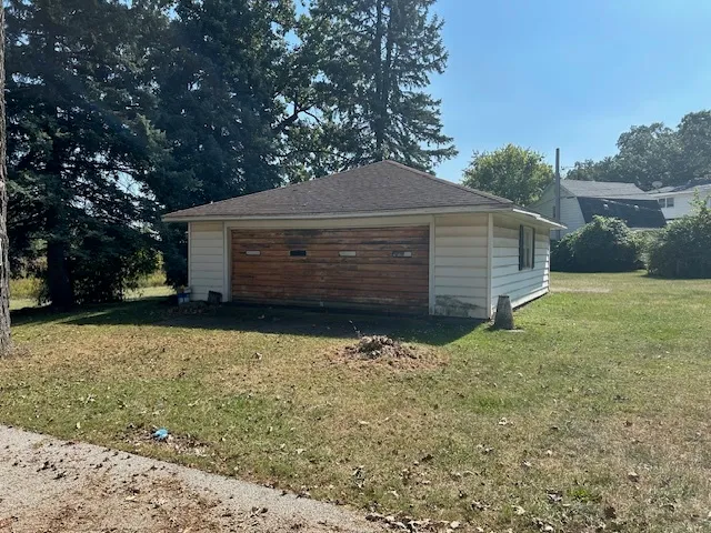 a view of a backyard of the house