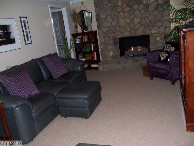 423 Kyle Road Winston-Salem, NC 27104 - Photo 14 of 16 Den/Family/Great Room. Another get away for your family! Stone Fireplace with Gas Logs. Lots of warm carpeting! Home also has two sets of beautifully finished solid hardwood stairs that lead you upstairs!
