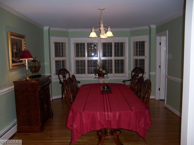 423 Kyle Road Winston-Salem, NC 27104 - Photo 4 of 16 Dining Room. Large lovely dining room with bay window! Plantation shutters/ chair moldings and ceiling moldings too!
