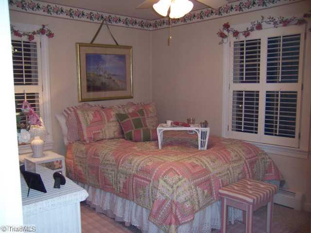 423 Kyle Road Winston-Salem, NC 27104 - Photo 10 of 16 2nd Bedroom. Plantation shutters through-out! Carpeting over original hardwood floors too!
