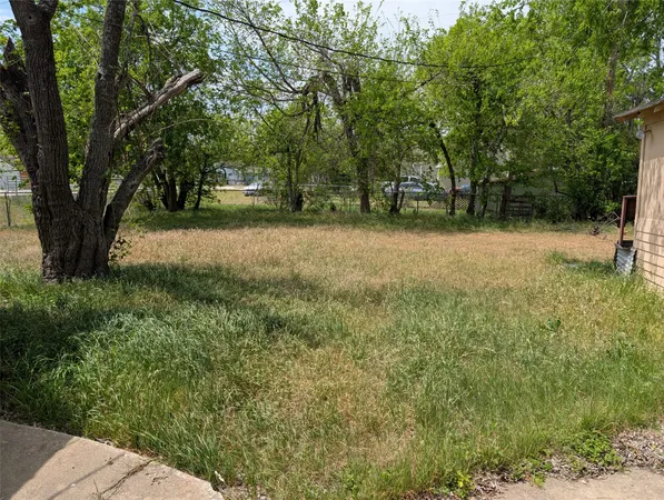 a view of outdoor space with deck and yard