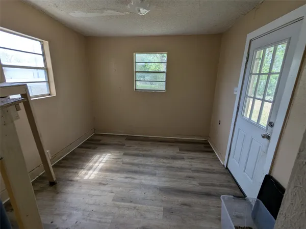 a view of room with window and hardwood floor