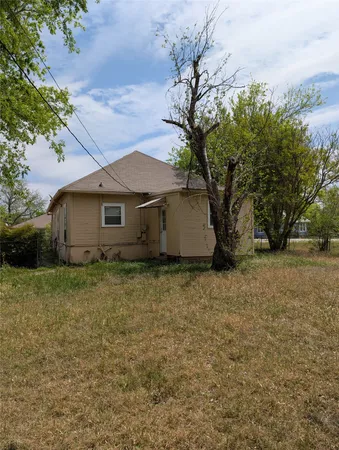 a house with trees in the background