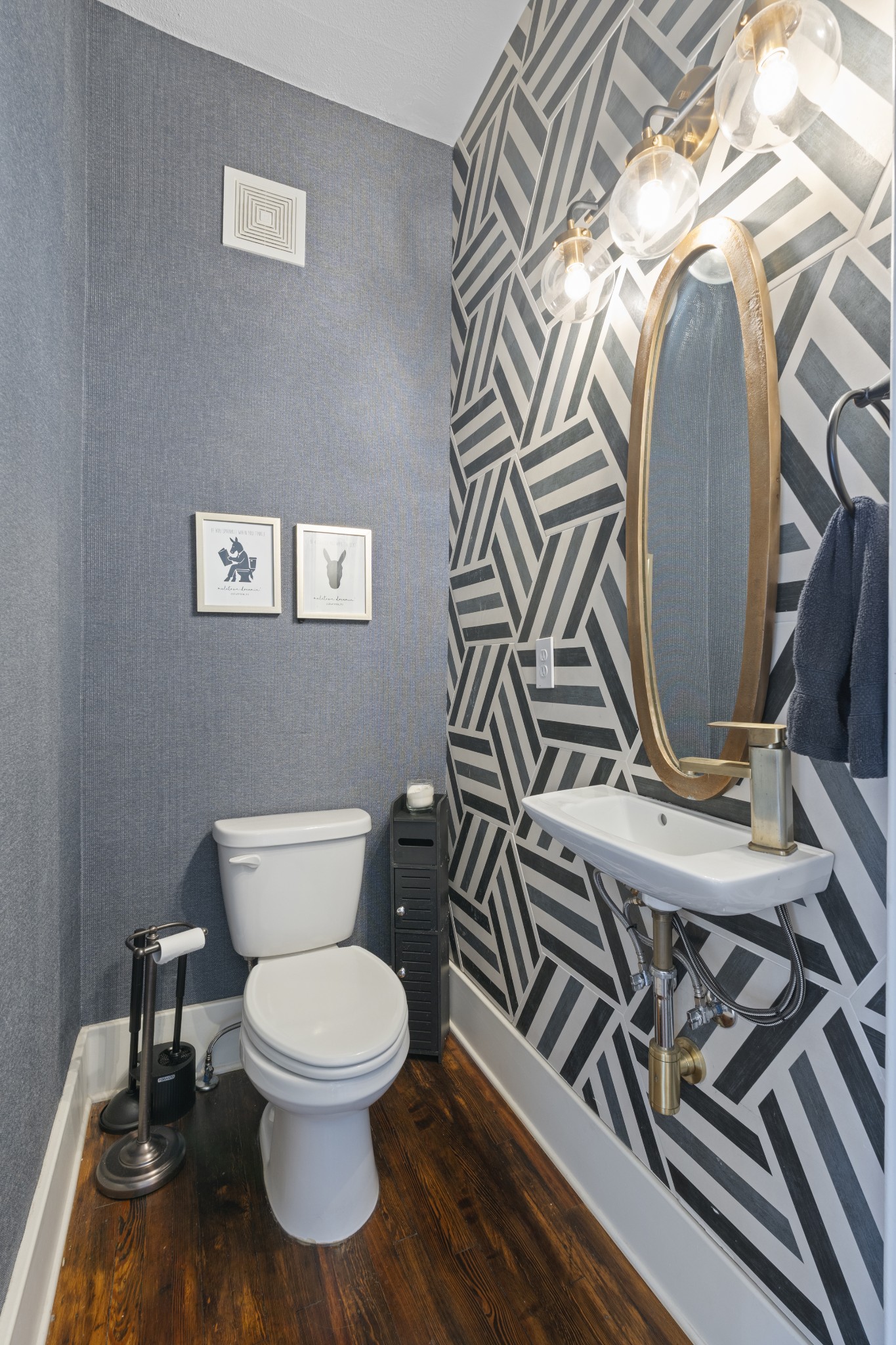 706 West 7th Street Columbia, TN 38401 - Photo 15 of 52 a bathroom with a toilet a sink and a mirror
