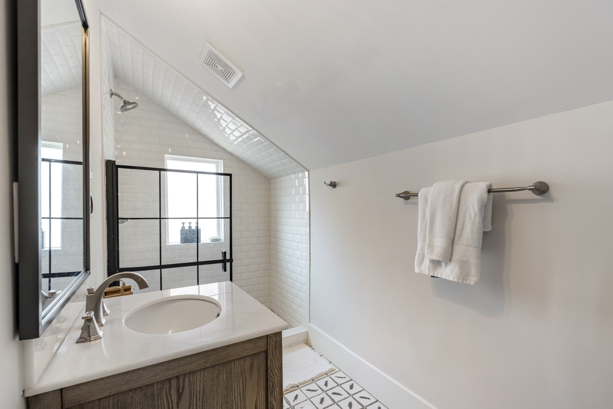 706 West 7th Street Columbia, TN 38401 - Photo 21 of 52 a bathroom with a granite countertop sink a mirror and shower