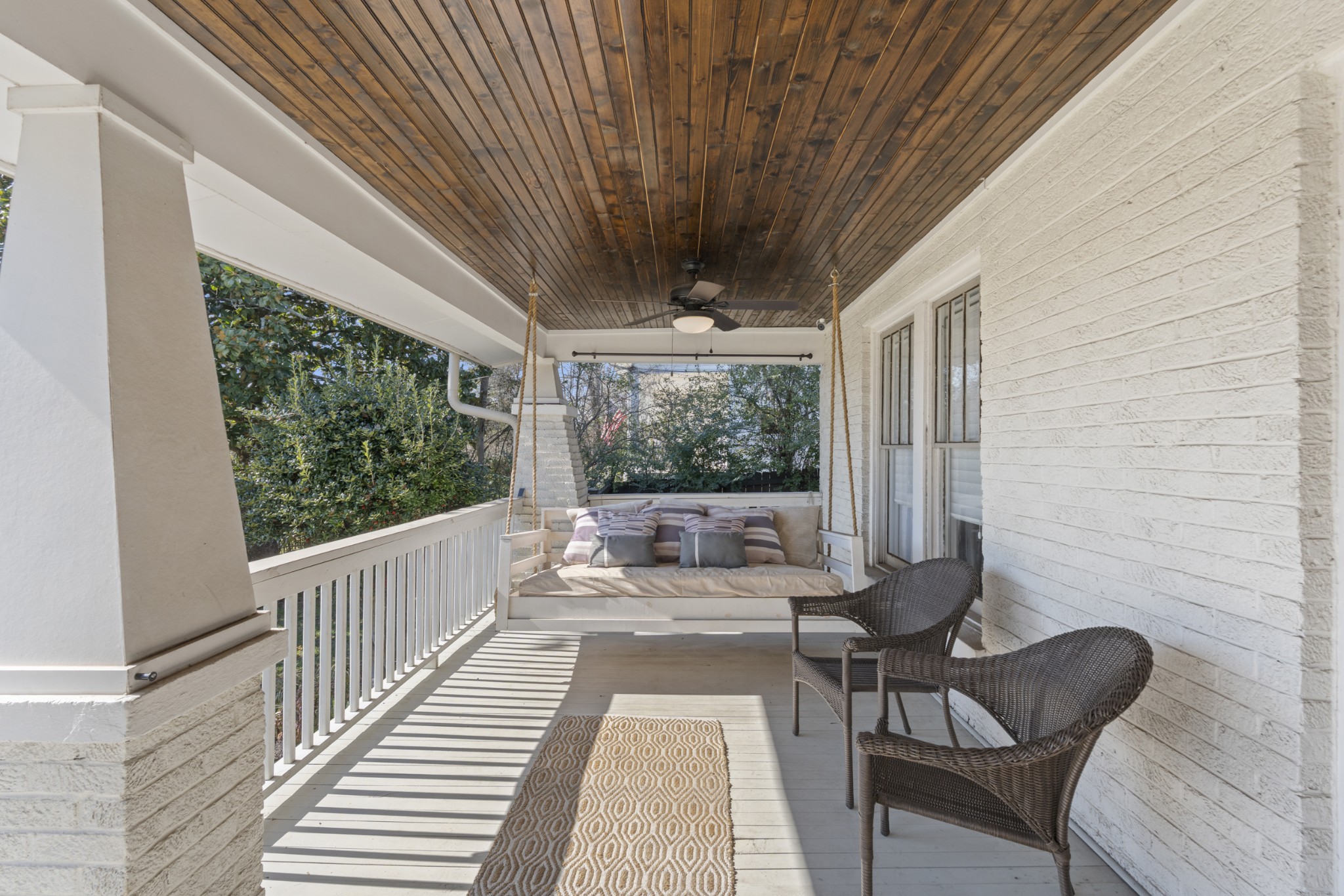 706 West 7th Street Columbia, TN 38401 - Photo 3 of 52 a balcony with wooden floor and outdoor seating