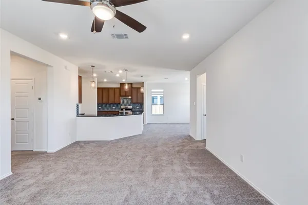 a view of a kitchen with a sink and a window