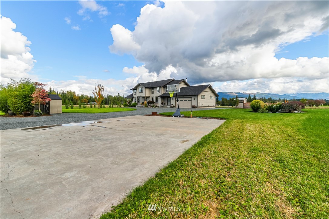 1970 East Hemmi Road Everson, WA 98247 - Photo 40 of 40 a view of a house with a big yard and potted plants