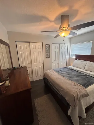 a bedroom with a bed and a television