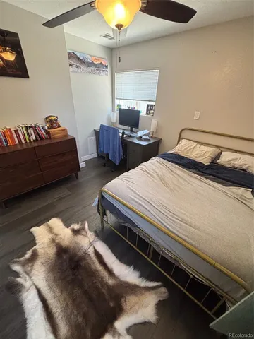 a bedroom with bed and a couch