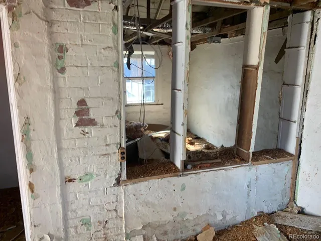 a bathroom with a granite countertop shower and a sink