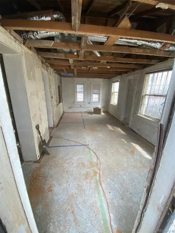 a view of a water heater room with a fireplace