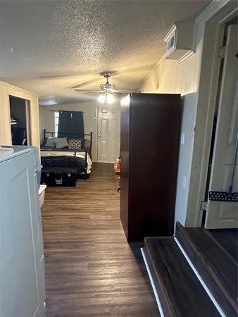 a view of living room with furniture and a flat screen tv