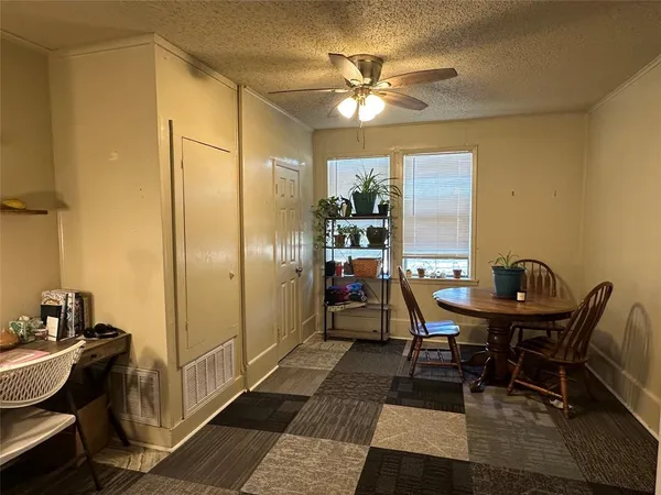 a workspace room with furniture and chandelier