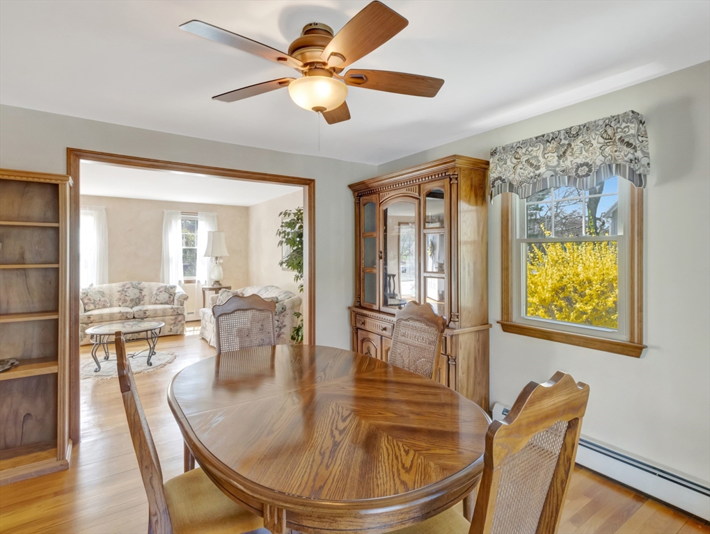 15 Riverside Drive Mansfield, MA 02048 - Photo 8 of 42 a dining room with furniture a chandelier and wooden floor
