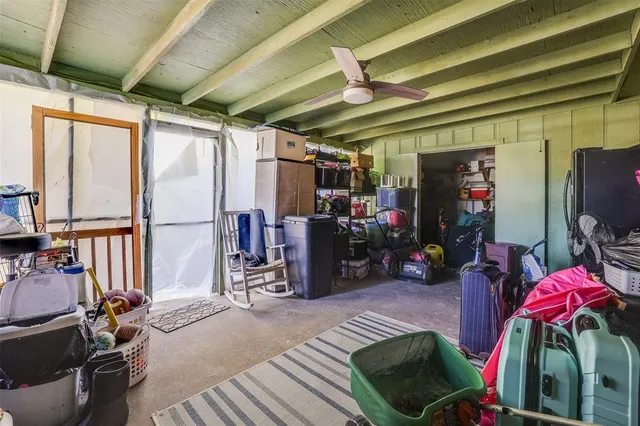 a view of gym equipment and windows in a room