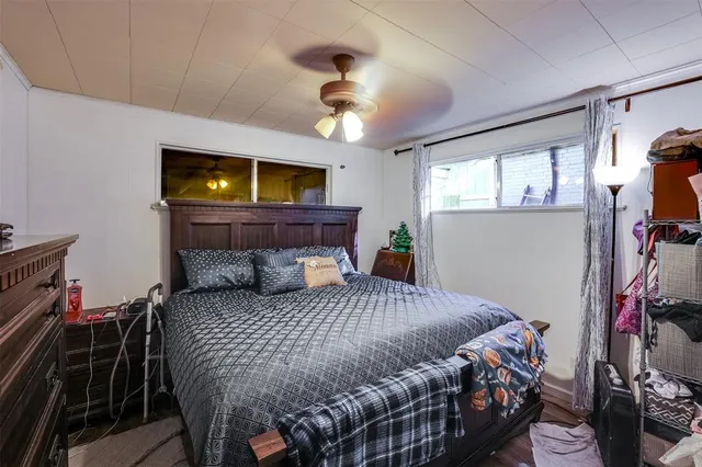 a bedroom with a bed and a tv